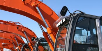 Industrial farm machinery painted in bright orange Environ II Waterborne Enamel Series 3800.